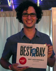 St. Petersburg College faculty member Mark Feinman accepts the Best of the Bay award from Creative Loafing on behalf of his La Lucha bandmates.