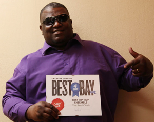 Rashad Harrell, a member of The Real Clash, holds his group's Best of the Bay award from Creative Loafing