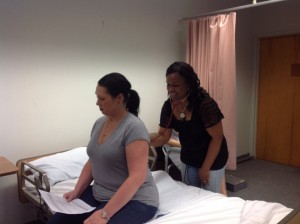 Debra Baumberger and Stacey Ann Cunningham practicing the respiratory exam