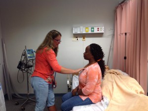 Kimberlee Hinrichs and Tracie Barber pracicing the cardiovascular exam