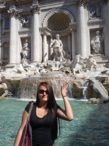 Tossing the three coins in the Trevi Fountain.