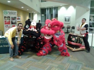 CL International Club President, Sane Haidara with the Lion Dance Performers