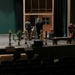 Photo of students working on the set