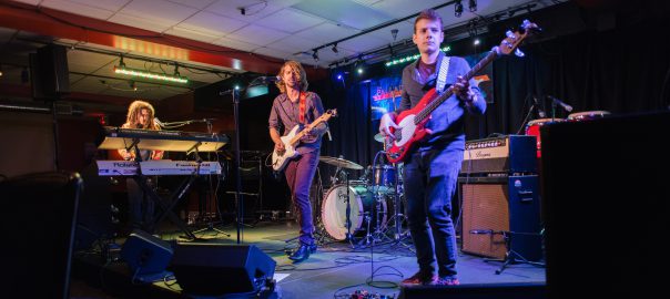 A band performs on stage.