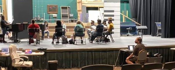 Tech crew and actors work on production