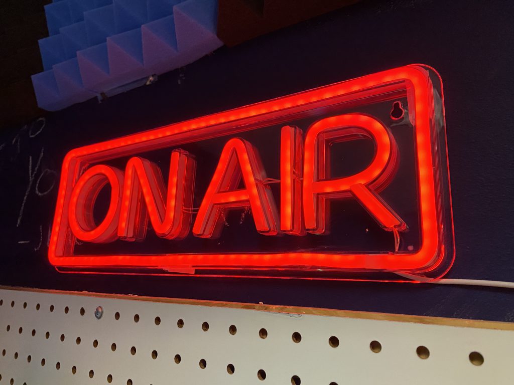 The ON AIR sign illuminates to indicate recording is in session within the SPC Digital Media Audio Recording Booth.