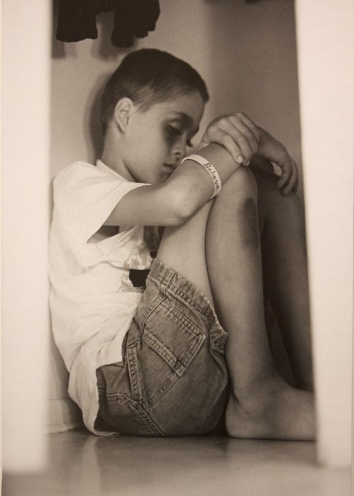 Photo of child with "believe" bracelet