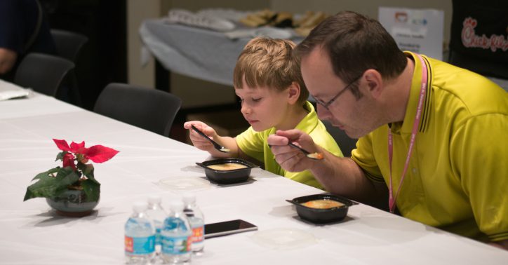 Father and son eating lunch at Empty Bowls