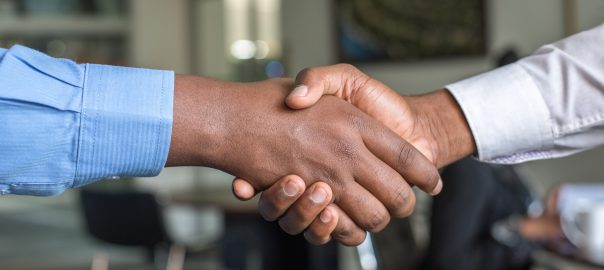 Two men shaking hands.
