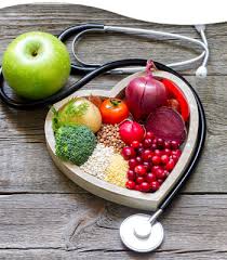 Picture of fruit and veggies in a heart shaped bowl with a stethoscope
