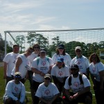 SPC volunteers at the Special Olympics in front of the soccer goal.