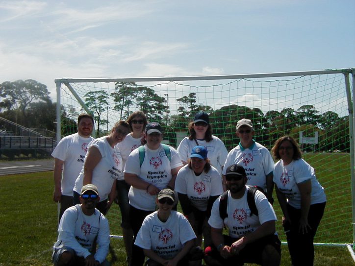 SPC volunteers at the Special Olympics in front of the soccer goal.