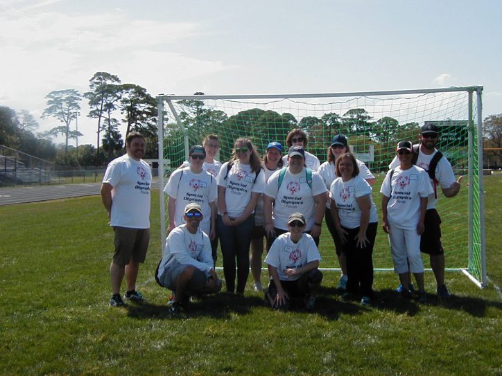 SPC volunteers at the Special Olympics in front of the soccer goal.