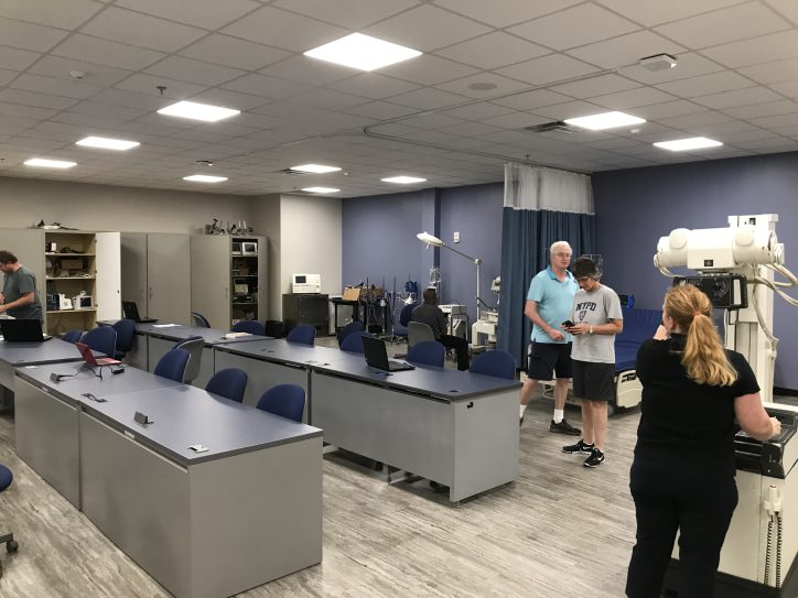 people at engineering technology open house looking at equipment