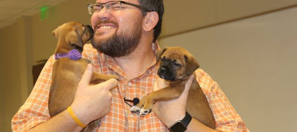 Charley Belcher with Vet Tech Puppies