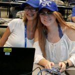 Students wearing SPC hats
