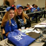 Students wearing SPC hats