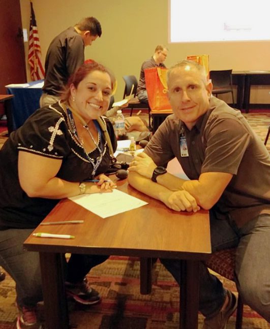 Nursing student Tiffany Bullock assists an employee at All College Day.