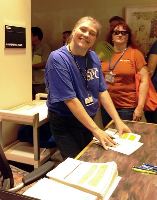 Nursing student Julie Ouahman greets SPC employees at All College Day.