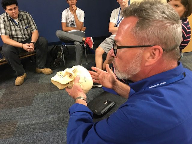 A&P Jim looking at human skull