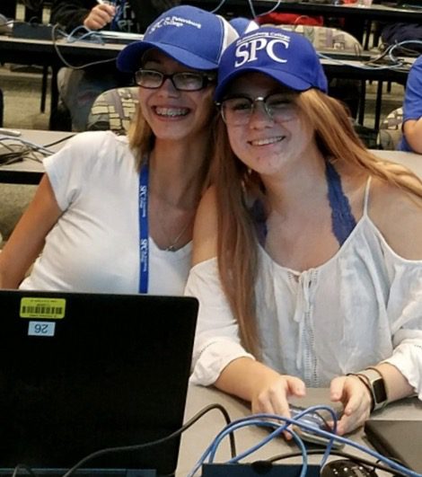 Students wearing SPC hats