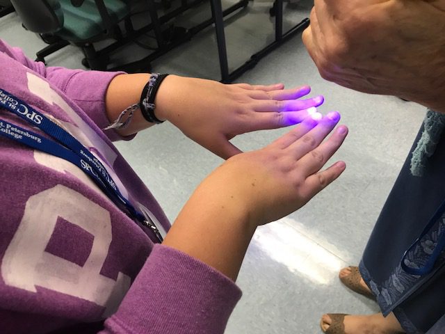 Blacklight over finger nails