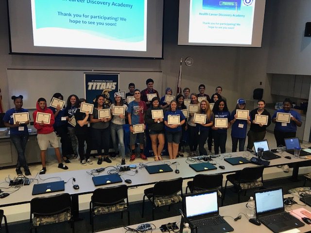 health career students holding up their certificates