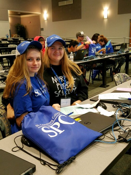 Students wearing SPC hats