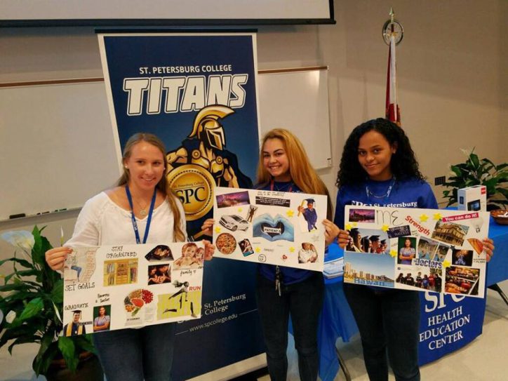 Students holding up their vision boards