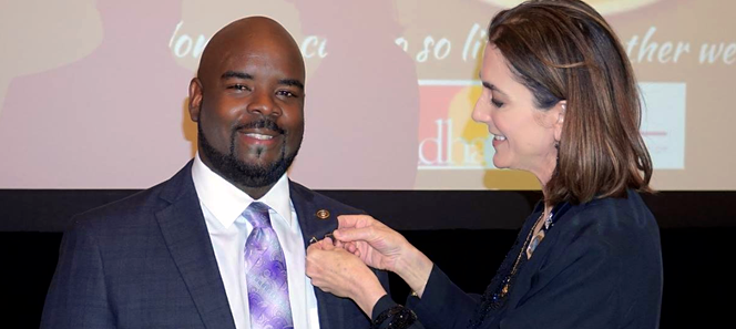 Dr. Alwyn Leiba recieving his presidential FDHA status on stage