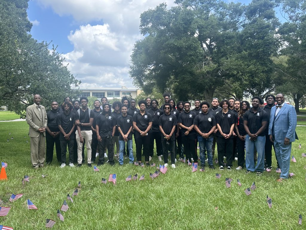 A large group of Clearwater FAAME students in dark shirts.