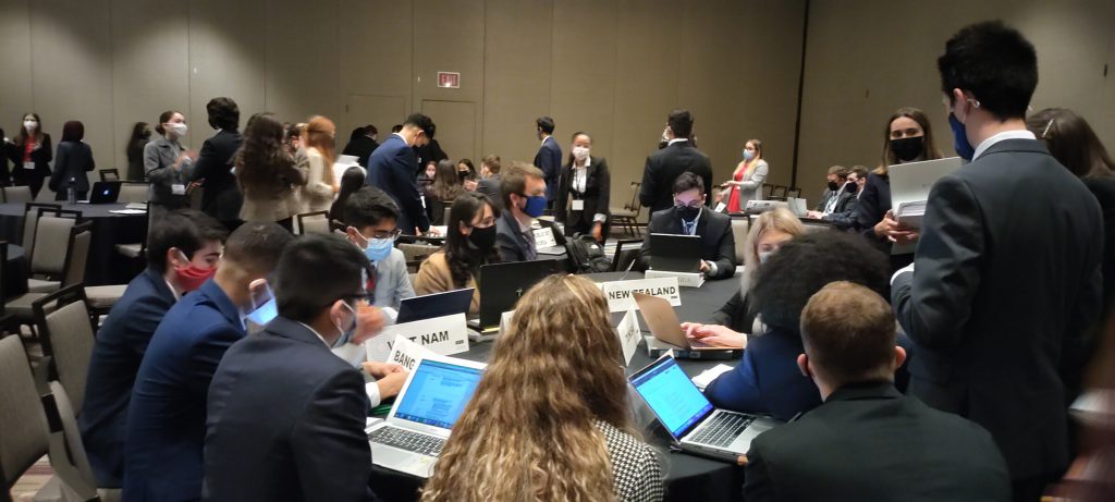 model un team works at a table