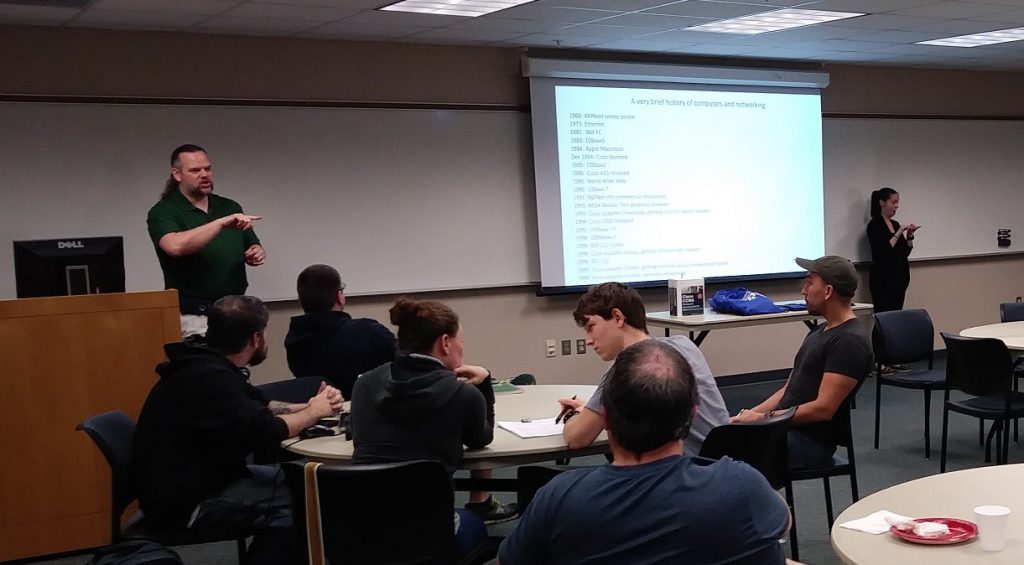 Jeremy Bresley speaks to a group of SPC networking club students