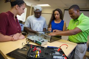 SPC cybersecurity faculty and students learning hands-on